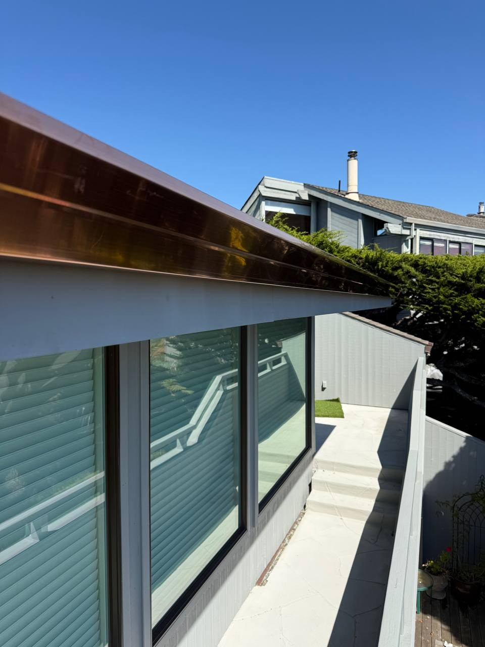 Installed copper gutter along the roofline