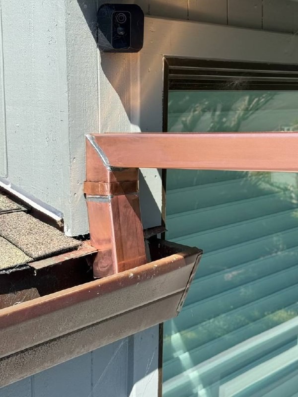 Close-up of a copper elbow and joined seams