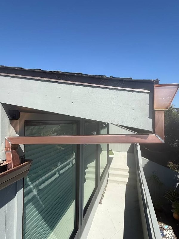 Copper routing beneath the roof edge