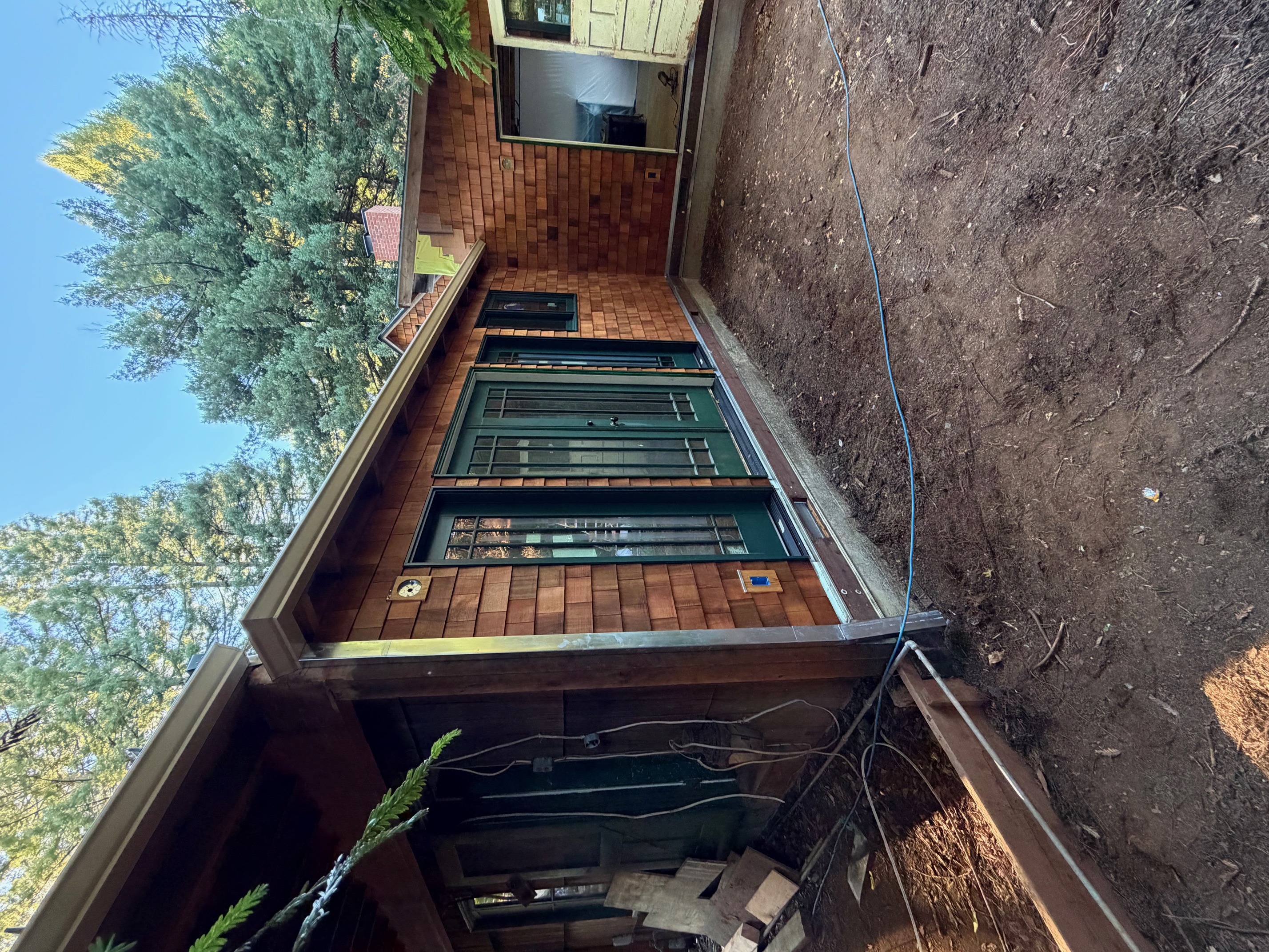 Seamless gutter installed on cedar cabin wooded property