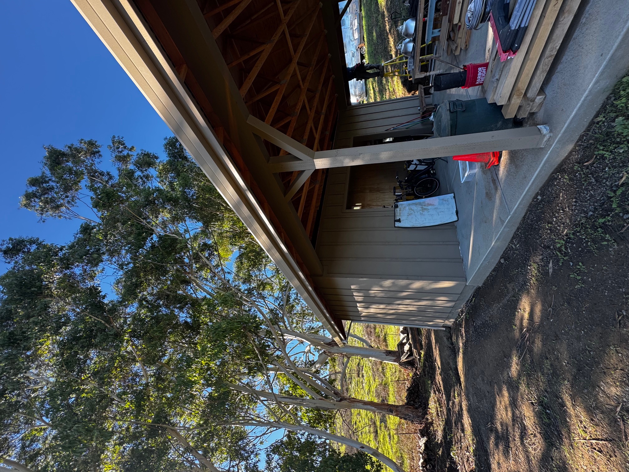 Long single-piece seamless gutter run outbuilding barn